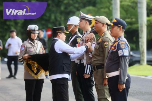 Pj Gubernur Elen Setiadi Pimpin Apel Gelar Pasukan Operasi Lilin Musi 2024. Foto : viralsumsel.com /win